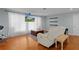 Bright living room with large windows, hardwood floors, and stylish furnishings at 2022 Edgewood Rd, Leesburg, FL 34748