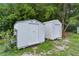 Outdoor storage sheds surrounded by lush greenery, providing ample space for tools and equipment at 2022 Edgewood Rd, Leesburg, FL 34748