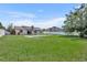 Large backyard featuring in-ground pool, shed, and ample green space, ideal for recreation at 2104 Winding Ridge S Ave, Kissimmee, FL 34741