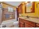 Cozy bathroom featuring yellow walls and a wood vanity at 2104 Winding Ridge S Ave, Kissimmee, FL 34741