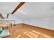 Spacious living room with vaulted ceilings, exposed beams, and hardwood floors at 2104 Winding Ridge S Ave, Kissimmee, FL 34741