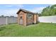 Outdoor shed providing extra storage space for tools and equipment in the backyard at 2104 Winding Ridge S Ave, Kissimmee, FL 34741