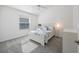 Carpeted bedroom with bright white walls, ceiling fan, and window letting in natural light at 2142 Weber Ct, The Villages, FL 32163