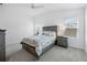 Bedroom featuring a bed with nightstands, a ceiling fan and big windows for natural light at 2142 Weber Ct, The Villages, FL 32163