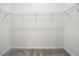 An empty walk-in closet with wire shelving, ready to be filled at 2142 Weber Ct, The Villages, FL 32163