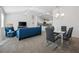 Open-concept living room and dining area with a contemporary design, seamlessly connected to the kitchen at 2142 Weber Ct, The Villages, FL 32163