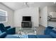 Bright living room features modern furnishings, neutral walls, ceiling fan, and a large window at 2142 Weber Ct, The Villages, FL 32163