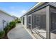 Back screened patio with an exterior view of the backyard at 2142 Weber Ct, The Villages, FL 32163