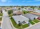 Wide aerial shot of a neighborhood featuring single story homes, green lawns, and quiet streets at 2235 Harbor Town Ln, Lakeland, FL 33810