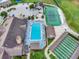 Aerial view of community pool, tennis courts, shuffleboard and clubhouse at 2235 Harbor Town Ln, Lakeland, FL 33810