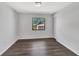 Cozy bedroom with wood flooring, closet, and a window with a view at 2235 Harbor Town Ln, Lakeland, FL 33810