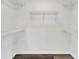 Walk-in closet featuring a clean interior, wood flooring, and wire shelving at 2235 Harbor Town Ln, Lakeland, FL 33810