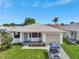 Charming single-story home featuring a well-maintained lawn and an attached one-car garage at 2235 Harbor Town Ln, Lakeland, FL 33810
