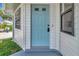Inviting front door with a light blue finish and a modern design at 2235 Harbor Town Ln, Lakeland, FL 33810