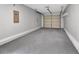 Spacious two car garage with painted floor and automatic door at 2235 Harbor Town Ln, Lakeland, FL 33810