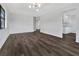 Open-concept living area featuring dark wood flooring, lots of light, and an open floor plan at 2235 Harbor Town Ln, Lakeland, FL 33810