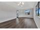 Bright living room with dark wood floors and ample natural light at 2235 Harbor Town Ln, Lakeland, FL 33810