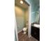 Bathroom featuring a toilet, vanity with sink, and a small storage shelf at 2441 Nellie Rd, The Villages, FL 32163