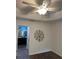 Cozy bedroom with a ceiling fan and an ensuite bathroom at 2441 Nellie Rd, The Villages, FL 32163