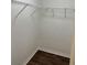 Walk-in closet featuring wood-look floors and white wire shelving at 2441 Nellie Rd, The Villages, FL 32163