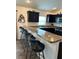 Stylish kitchen with a breakfast bar and seating for casual dining at 2441 Nellie Rd, The Villages, FL 32163
