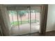 Screened in patio with a view of the backyard at 2441 Nellie Rd, The Villages, FL 32163