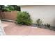 Side yard with mature bushes and a concrete walkway with a low maintenance design at 2441 Nellie Rd, The Villages, FL 32163