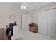 Bedroom with closet, bookshelf, neutral tones, and ceiling fan at 2738 Morven Park Way, The Villages, FL 32162