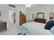 Relaxing bedroom includes a ceiling fan, ample dresser space, and calming decor to promote relaxation at 2738 Morven Park Way, The Villages, FL 32162