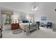 Cozy bedroom with a comfortable bed, ceiling fan, and bedside lamps for a relaxing ambiance at 2738 Morven Park Way, The Villages, FL 32162
