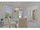 Charming breakfast nook with a glass table and window view, perfect for morning meals at 2738 Morven Park Way, The Villages, FL 32162