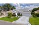 Charming single-story home with well-manicured front lawn and patterned driveway at 2738 Morven Park Way, The Villages, FL 32162