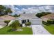 Charming single-story home with well-manicured lawn and patterned driveway at 2738 Morven Park Way, The Villages, FL 32162