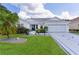 Charming single-story home with a well-manicured lawn, a decorative driveway, and a two-car garage at 2738 Morven Park Way, The Villages, FL 32162
