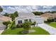 Charming home with well-maintained landscaping, a decorative driveway, and a bright white exterior at 2738 Morven Park Way, The Villages, FL 32162