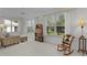 Inviting living room with natural light, comfortable seating, and a relaxing ambiance at 2738 Morven Park Way, The Villages, FL 32162