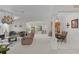 Spacious and bright living room and dining area with neutral decor, comfortable seating, and large windows at 2738 Morven Park Way, The Villages, FL 32162
