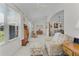 Open living room featuring neutral walls, plush seating, and a dining area at 2738 Morven Park Way, The Villages, FL 32162