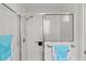 Clean bathroom shower featuring tile surround and glass door at 2738 Morven Park Way, The Villages, FL 32162