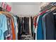 Organized walk-in closet features wire shelving and ample storage for clothing and accessories at 2738 Morven Park Way, The Villages, FL 32162