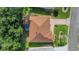 Aerial view of the home showcasing its roof, backyard, driveway, and surrounding landscaping at 2766 Privada Dr, The Villages, FL 32162