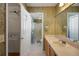 Floral wallpaper in a bathroom with a walk in closet at 2766 Privada Dr, The Villages, FL 32162