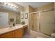 Well-lit bathroom featuring a shower over tub, vanity with a sink, and neutral color scheme at 2766 Privada Dr, The Villages, FL 32162