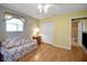 Bright bedroom with closet and a comfortable couch, creating a versatile space at 2766 Privada Dr, The Villages, FL 32162