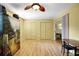Versatile flex space with two closets, wood floors and view of a dining/living area at 2766 Privada Dr, The Villages, FL 32162