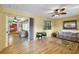 Open flex space leads to sun room. Wood floors, view of bedroom makes this a great option at 2766 Privada Dr, The Villages, FL 32162