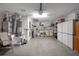 Spacious garage with ample storage, washer, dryer, water heater, and utility sink at 2766 Privada Dr, The Villages, FL 32162