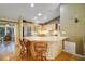 Eat-in kitchen with an island, bar seating, and stainless steel appliances at 2766 Privada Dr, The Villages, FL 32162