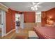 Spacious main bedroom featuring an ensuite bathroom and a dining area with a ceiling fan at 2766 Privada Dr, The Villages, FL 32162