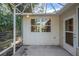 The screened in porch of a house with white vinyl siding at 2766 Privada Dr, The Villages, FL 32162